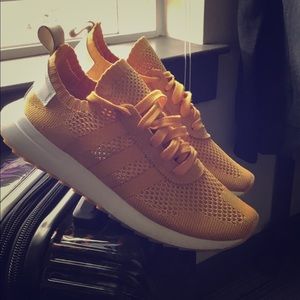 Yellow adidas sneakers